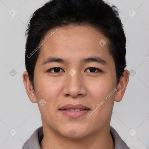 Joyful asian young-adult male with short  black hair and brown eyes