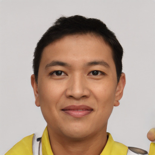 Joyful latino young-adult male with short  brown hair and brown eyes