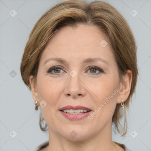 Joyful white adult female with medium  brown hair and grey eyes