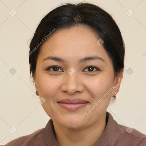 Joyful latino young-adult female with medium  brown hair and brown eyes