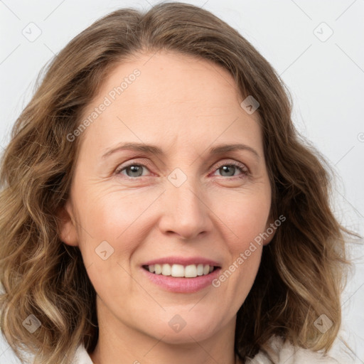 Joyful white adult female with medium  brown hair and grey eyes