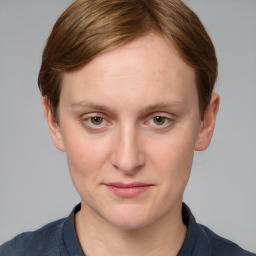 Joyful white young-adult female with medium  brown hair and blue eyes