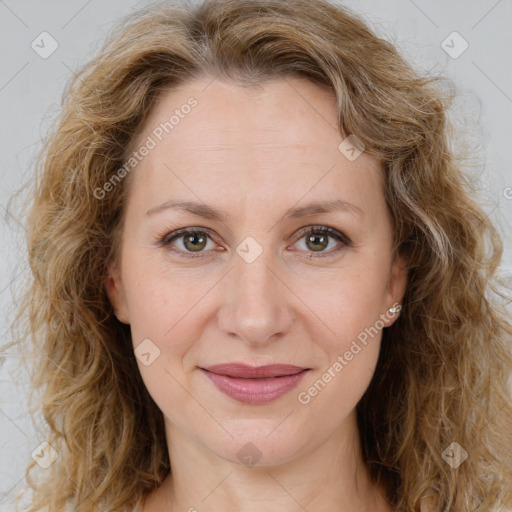 Joyful white adult female with long  brown hair and brown eyes