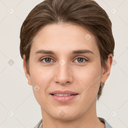 Joyful white young-adult female with short  brown hair and grey eyes