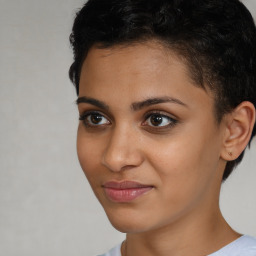 Joyful latino young-adult female with short  brown hair and brown eyes