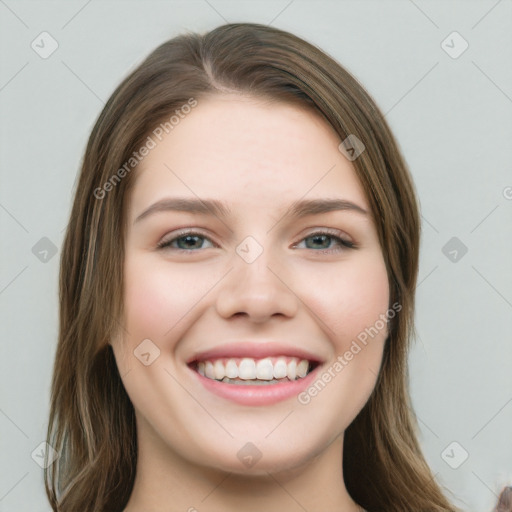 Joyful white young-adult female with long  brown hair and green eyes