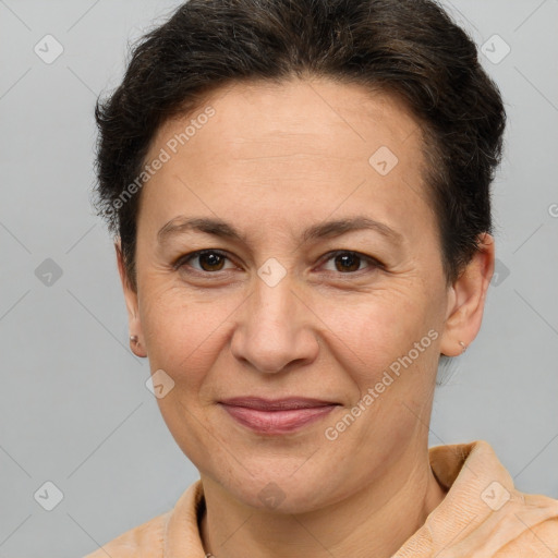 Joyful white adult female with short  brown hair and brown eyes