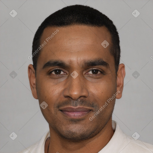 Joyful black young-adult male with short  black hair and brown eyes