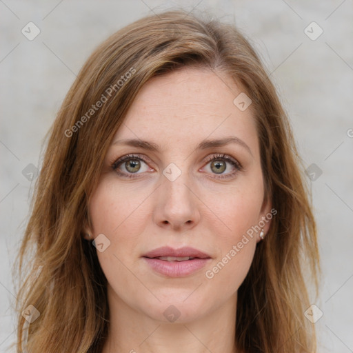 Joyful white young-adult female with long  brown hair and green eyes