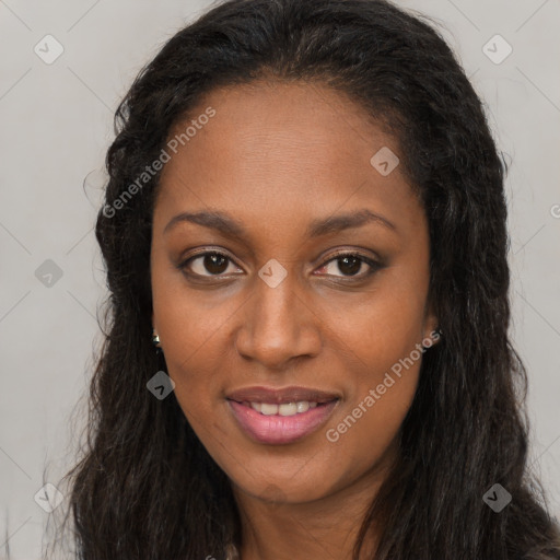 Joyful black young-adult female with long  brown hair and brown eyes