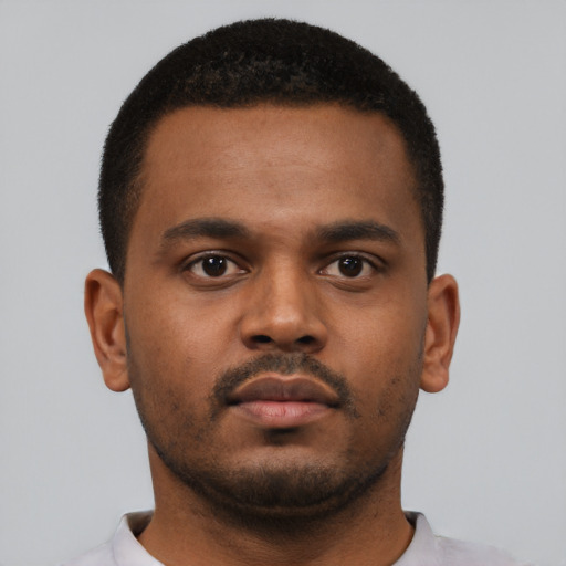 Neutral black young-adult male with short  black hair and brown eyes