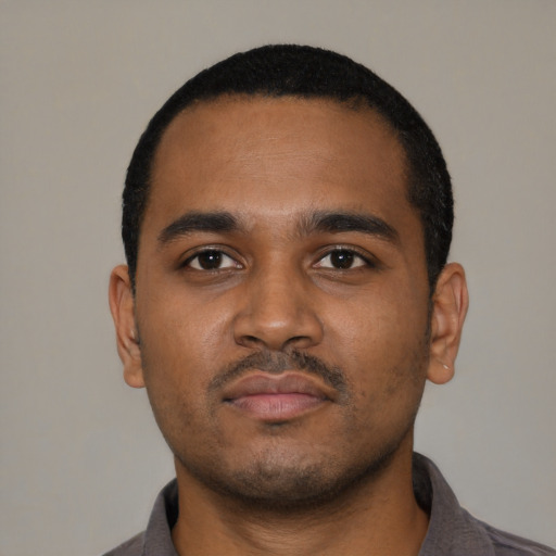 Neutral black young-adult male with short  black hair and brown eyes