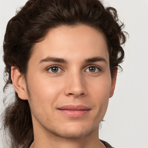 Joyful white young-adult male with medium  brown hair and brown eyes