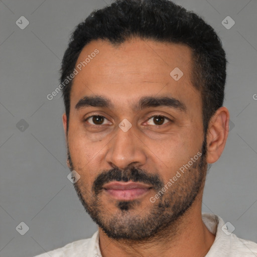 Joyful latino young-adult male with short  black hair and brown eyes