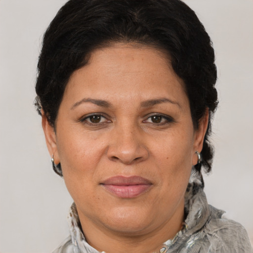 Joyful white adult female with short  brown hair and brown eyes