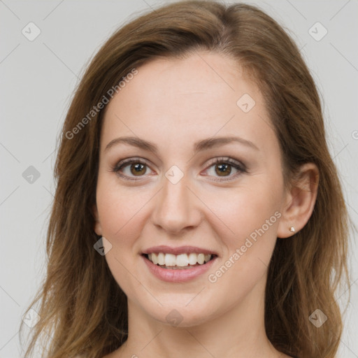 Joyful white young-adult female with long  brown hair and green eyes