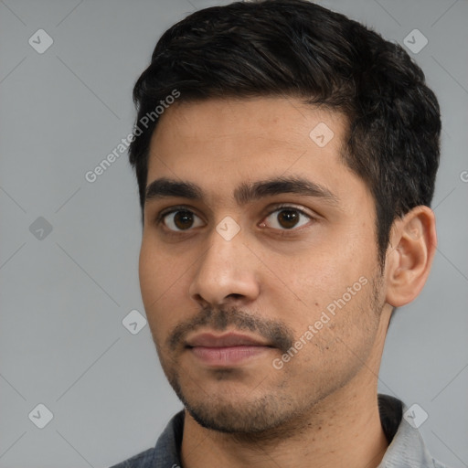 Neutral white young-adult male with short  black hair and brown eyes