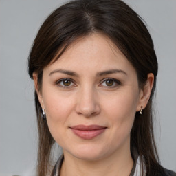 Joyful white young-adult female with medium  brown hair and brown eyes