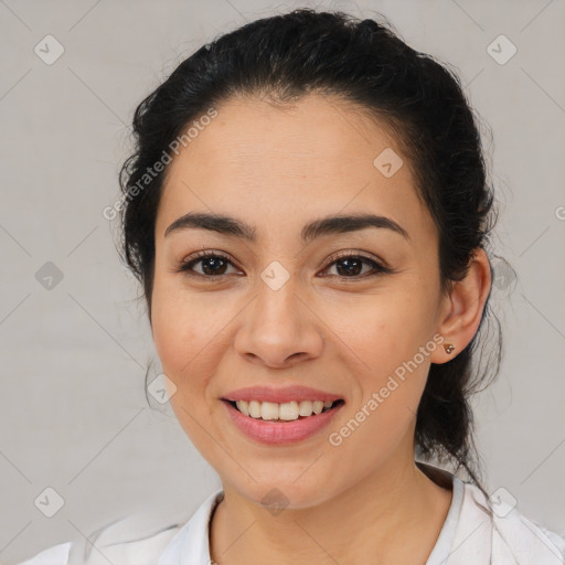 Joyful latino young-adult female with medium  brown hair and brown eyes