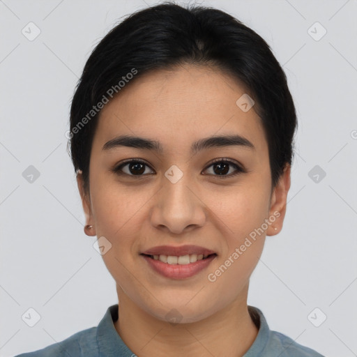 Joyful asian young-adult female with short  black hair and brown eyes