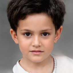 Joyful white child male with short  brown hair and brown eyes