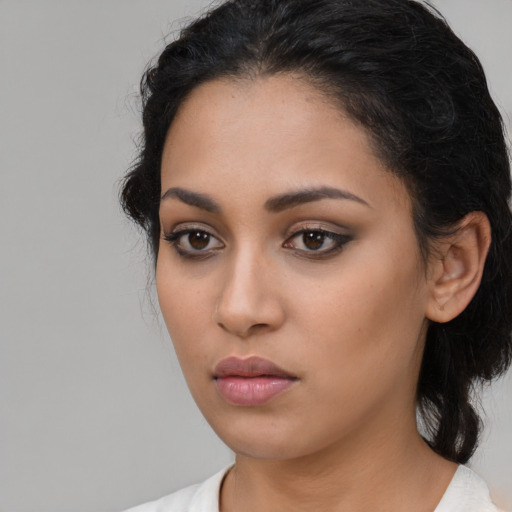 Neutral latino young-adult female with medium  black hair and brown eyes