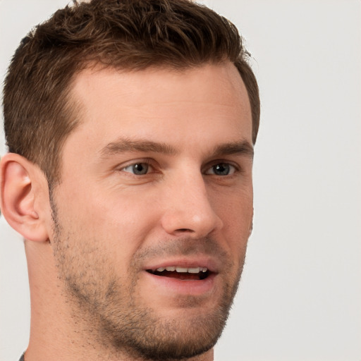 Joyful white young-adult male with short  brown hair and brown eyes