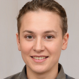 Joyful white young-adult female with short  brown hair and grey eyes