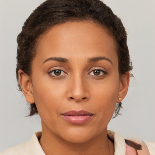 Joyful latino young-adult female with short  brown hair and brown eyes