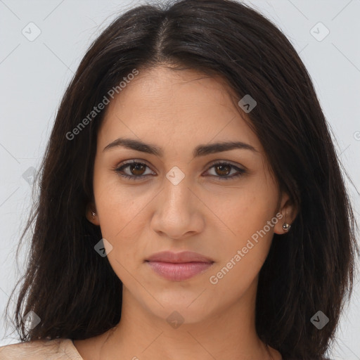 Joyful latino young-adult female with long  brown hair and brown eyes