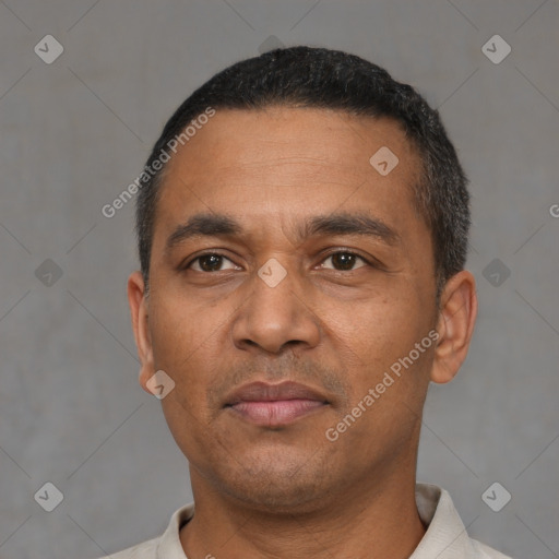 Neutral latino adult male with short  black hair and brown eyes