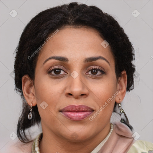 Joyful latino adult female with medium  brown hair and brown eyes