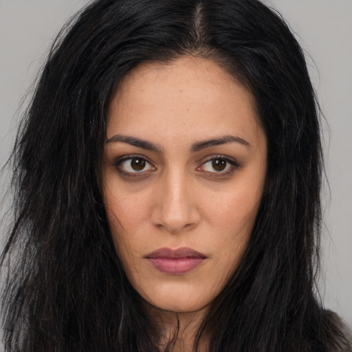 Neutral latino young-adult female with long  brown hair and brown eyes