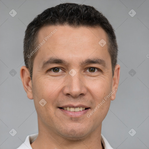 Joyful white adult male with short  brown hair and brown eyes