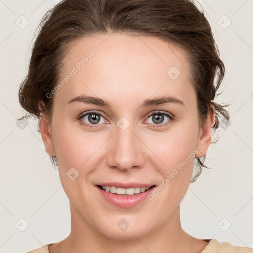 Joyful white young-adult female with medium  brown hair and green eyes