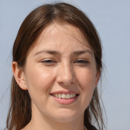 Joyful white adult female with long  brown hair and brown eyes