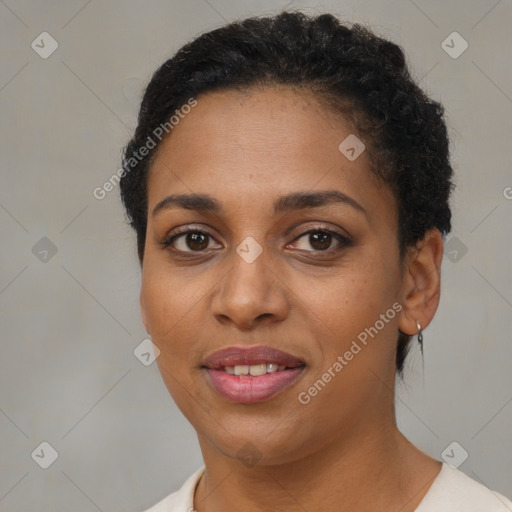 Joyful black young-adult female with short  brown hair and brown eyes