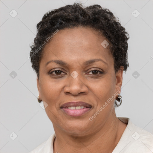 Joyful black adult female with short  brown hair and brown eyes