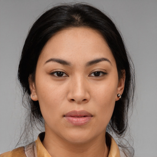 Joyful asian young-adult female with medium  brown hair and brown eyes