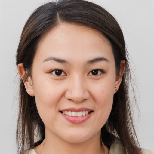 Joyful white young-adult female with medium  brown hair and brown eyes