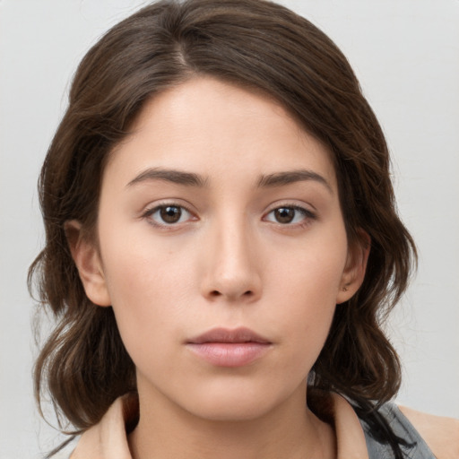 Neutral white young-adult female with medium  brown hair and brown eyes