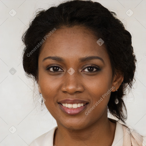 Joyful black young-adult female with long  brown hair and brown eyes