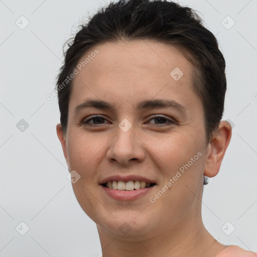 Joyful white young-adult female with short  brown hair and brown eyes