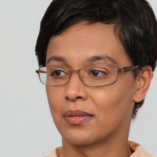 Joyful asian adult female with short  brown hair and brown eyes