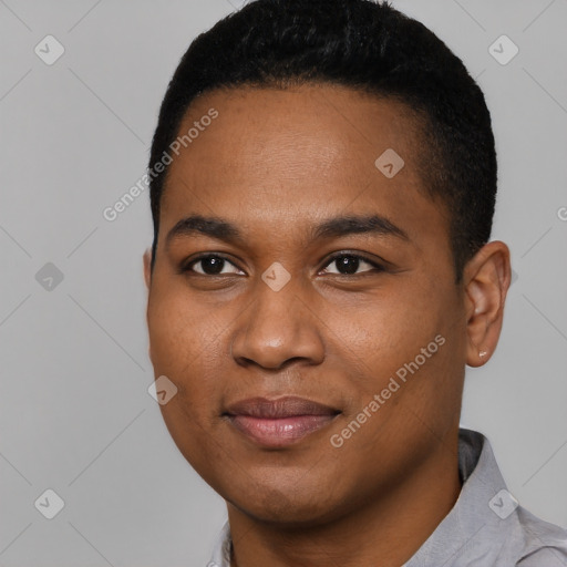 Joyful black young-adult male with short  black hair and brown eyes