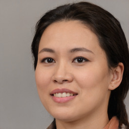 Joyful white young-adult female with medium  brown hair and brown eyes