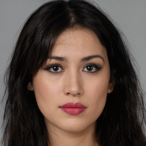 Neutral latino young-adult female with long  brown hair and brown eyes