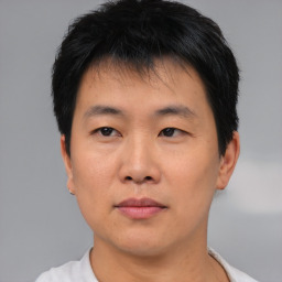 Neutral asian young-adult male with short  black hair and brown eyes