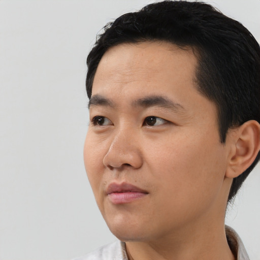 Neutral asian young-adult male with short  black hair and brown eyes