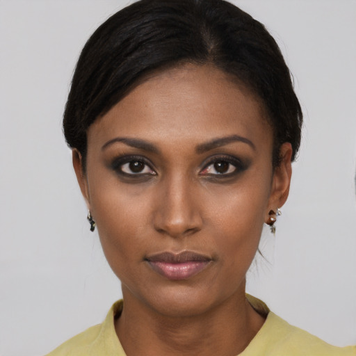 Neutral black young-adult female with short  brown hair and brown eyes